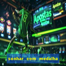 sonhar com medalha de santo